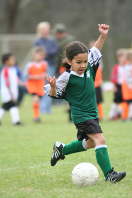 girl playing soccer